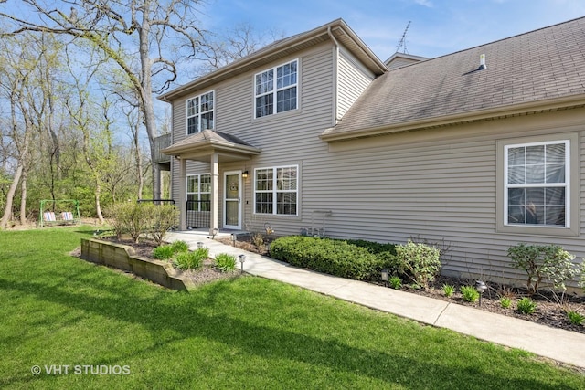 2831 Granite Ct, Crystal Lake, IL 60012 - view of front of house with a front yard and a shingled roof