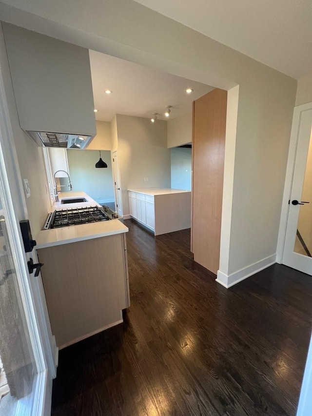 7841 W Argyle St, Norridge, IL 60706 - kitchen with dark wood-style flooring, a sink, light countertops, baseboards, and recessed lighting