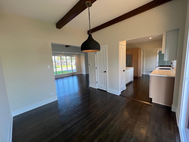 7841 W Argyle St, Norridge, IL 60706 - unfurnished living room with dark wood-style flooring, a sink, and baseboards