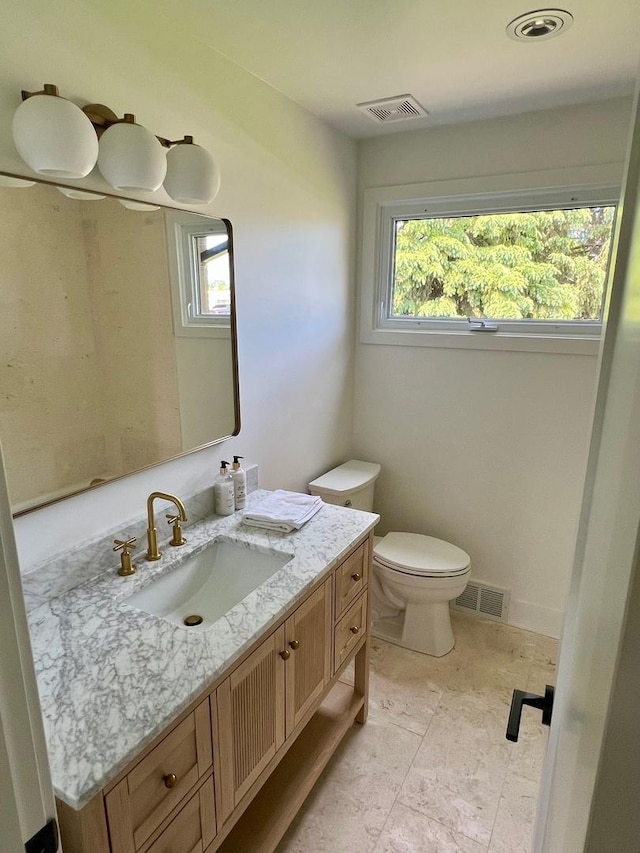 7841 W Argyle St, Norridge, IL 60706 - bathroom featuring vanity, plenty of natural light, and toilet