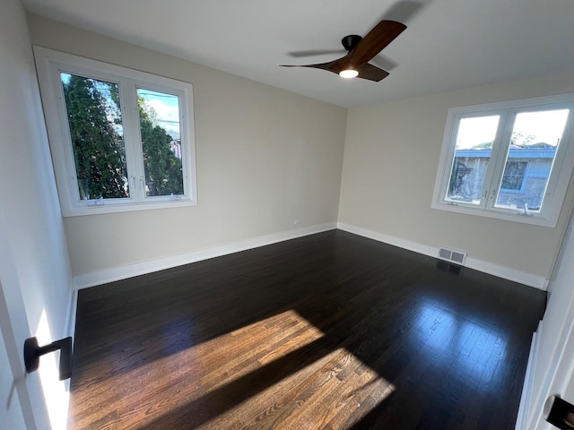 7841 W Argyle St, Norridge, IL 60706 - unfurnished room with dark wood finished floors, baseboards, and ceiling fan
