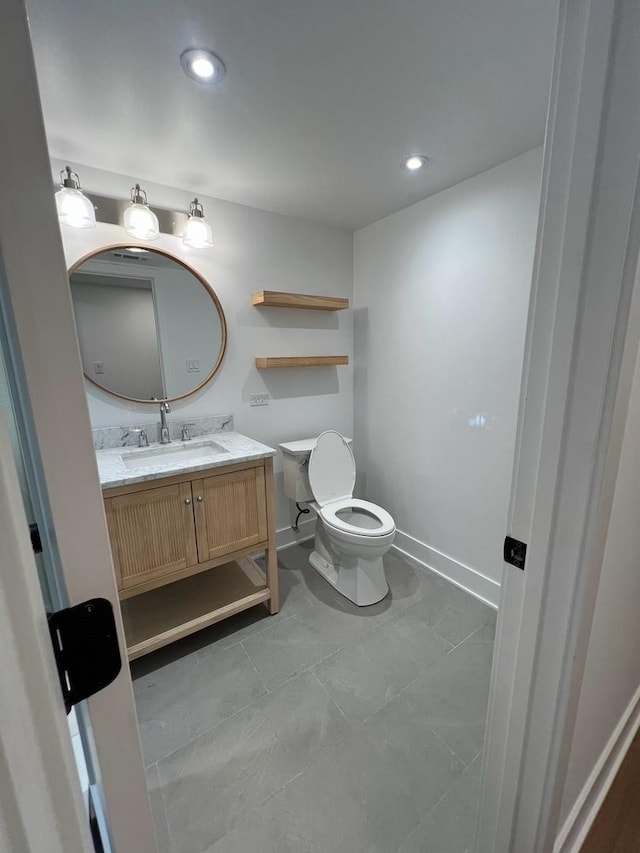 7841 W Argyle St, Norridge, IL 60706 - bathroom featuring vanity, toilet, baseboards, and recessed lighting