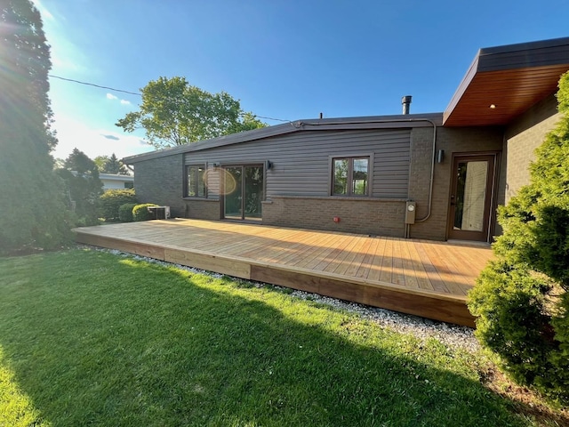 7841 W Argyle St, Norridge, IL 60706 - back of property with a yard, brick siding, and a wooden deck