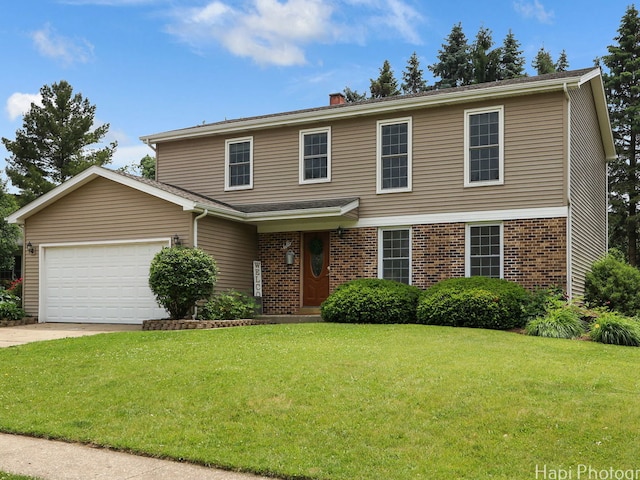 5501 Abbey Dr, Mchenry, IL 60050 - view of front of property featuring a front yard, an attached garage, brick siding, and a chimney