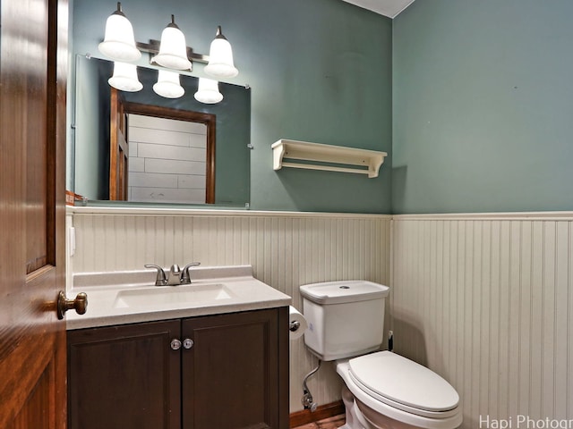 5501 Abbey Dr, Mchenry, IL 60050 - half bathroom with toilet, a wainscoted wall, and vanity
