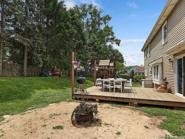 5501 Abbey Dr, Mchenry, IL 60050 - view of yard featuring a playground, a fire pit, and a wooden deck