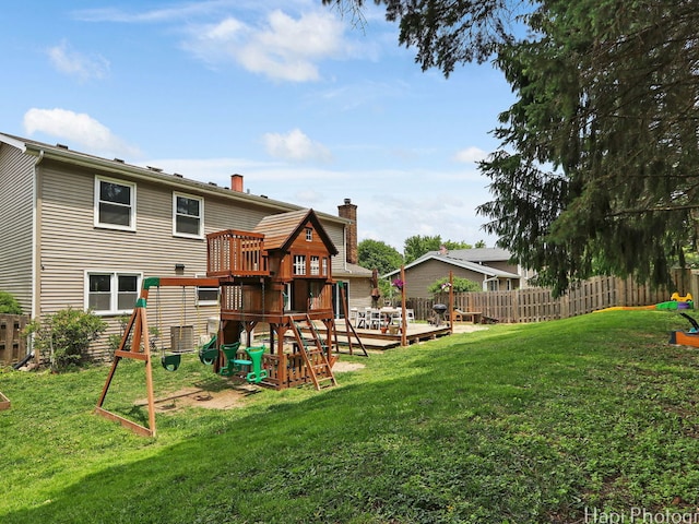 5501 Abbey Dr, Mchenry, IL 60050 - rear view of property featuring a playground, a chimney, and a deck