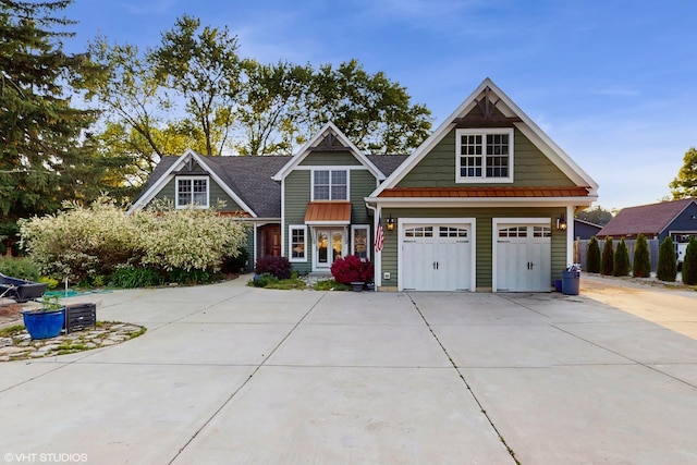8N594 S Mclean Blvd, South Elgin, IL 60177 - view of front of house featuring concrete driveway, a standing seam roof, and a metal roof