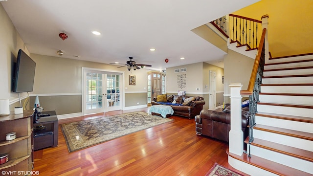8N594 S Mclean Blvd, South Elgin, IL 60177 - living room featuring wood finished floors, a ceiling fan, stairs, recessed lighting, and arched walkways