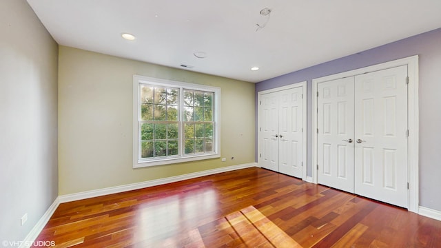 8N594 S Mclean Blvd, South Elgin, IL 60177 - unfurnished bedroom featuring multiple closets, wood finished floors, and recessed lighting