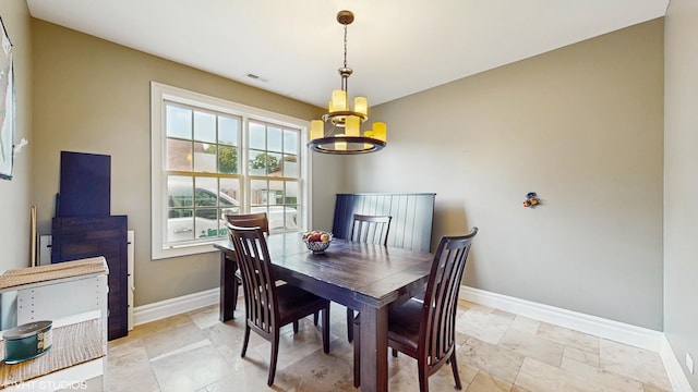 8N594 S Mclean Blvd, South Elgin, IL 60177 - dining space featuring a chandelier and light stone finish flooring
