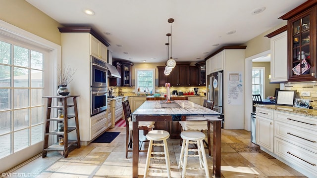 8N594 S Mclean Blvd, South Elgin, IL 60177 - kitchen with backsplash, wall chimney exhaust hood, glass insert cabinets, light stone countertops, and recessed lighting