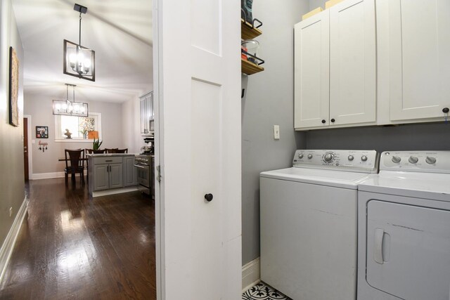 4419 N Racine Ave Unit 1N, Chicago, IL 60640 - laundry room with cabinet space, separate washer and dryer, baseboards, dark wood-type flooring, and a chandelier