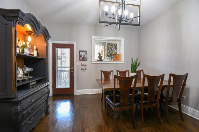4419 N Racine Ave Unit 1N, Chicago, IL 60640 - dining room with a chandelier, baseboards, and wood finished floors