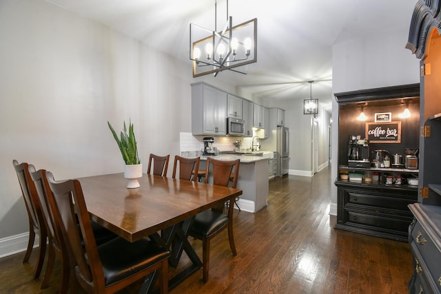 4419 N Racine Ave Unit 1N, Chicago, IL 60640 - dining area with a chandelier, dark wood-type flooring, and baseboards