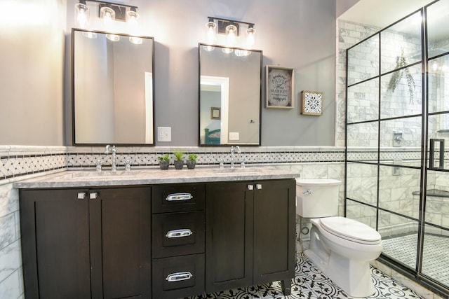 4419 N Racine Ave Unit 1N, Chicago, IL 60640 - bathroom featuring tile walls, double vanity, a stall shower, toilet, and tile patterned flooring