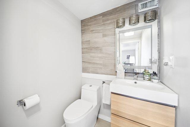 1221 N Dearborn St Unit 810S, Chicago, IL 60610 - bathroom with toilet, tile walls, and vanity