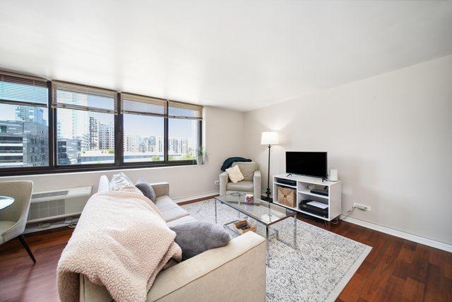 1221 N Dearborn St Unit 810S, Chicago, IL 60610 - living area featuring dark wood finished floors and baseboards