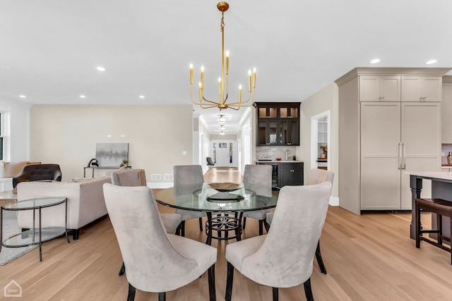 4920 Stonewall Ave, Downers Grove, IL 60515 - dining area with light wood finished floors, recessed lighting, a chandelier, and baseboards