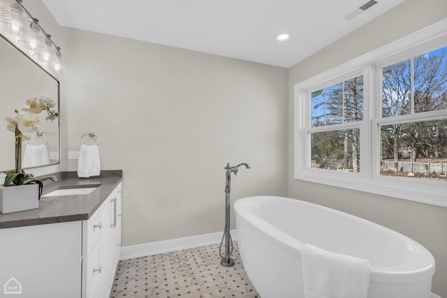 4920 Stonewall Ave, Downers Grove, IL 60515 - full bath with vanity, tile patterned floors, a soaking tub, baseboards, and recessed lighting