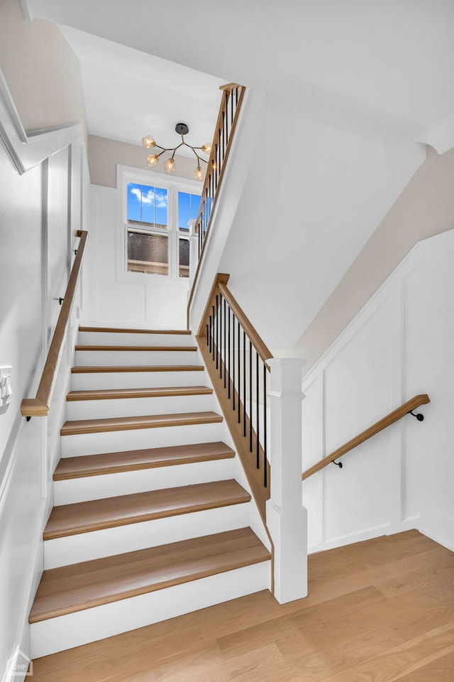 4920 Stonewall Ave, Downers Grove, IL 60515 - stairs featuring a chandelier and wood finished floors