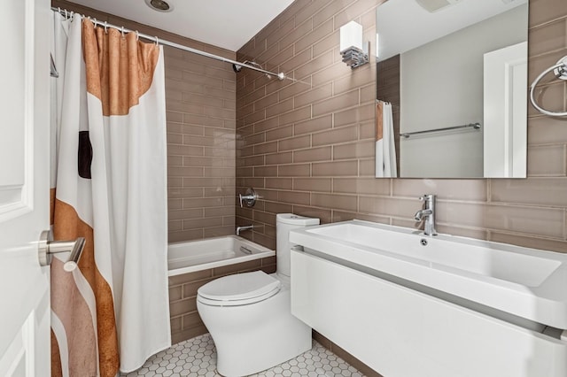 2004 W Erie St Unit 1W, Chicago, IL 60612 - full bathroom featuring shower / bathtub combination with curtain, toilet, vanity, tile patterned flooring, and tile walls