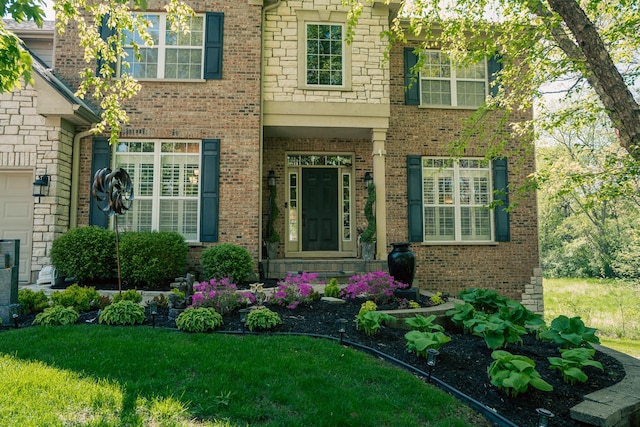406 Elderberry Ln, Streamwood, IL 60107 - view of front facade with brick siding and a front yard