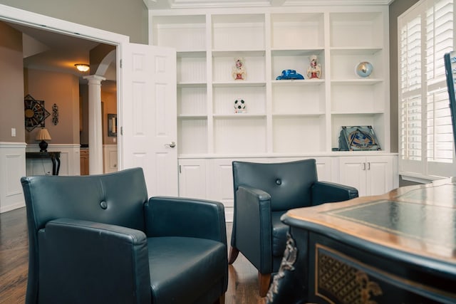 406 Elderberry Ln, Streamwood, IL 60107 - living area featuring ornate columns, dark wood-type flooring, a wainscoted wall, built in shelves, and a decorative wall