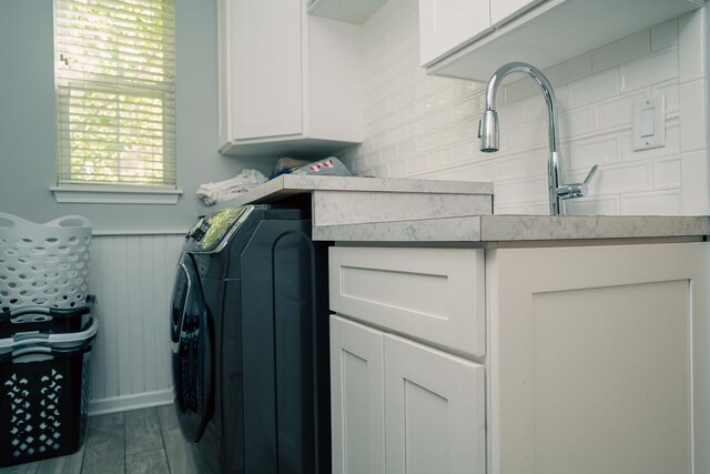 406 Elderberry Ln, Streamwood, IL 60107 - laundry area featuring cabinet space, washing machine and clothes dryer, and wood finished floors
