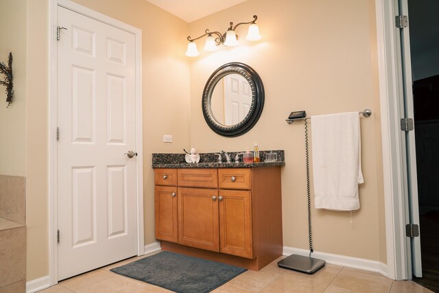 406 Elderberry Ln, Streamwood, IL 60107 - bathroom featuring tile patterned flooring, vanity, and baseboards