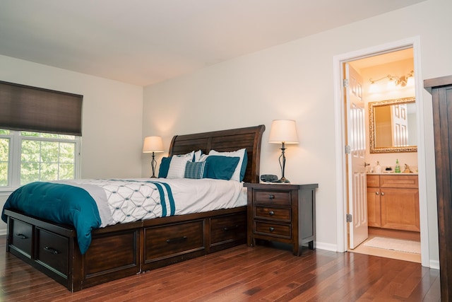 406 Elderberry Ln, Streamwood, IL 60107 - bedroom with dark wood-style floors, baseboards, and connected bathroom