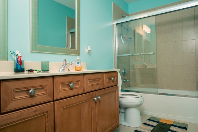 406 Elderberry Ln, Streamwood, IL 60107 - bathroom with vanity, toilet, shower / bath combination with glass door, and tile patterned floors