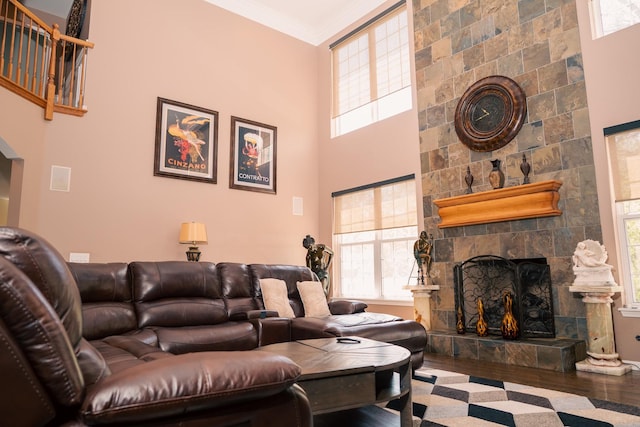 406 Elderberry Ln, Streamwood, IL 60107 - living room with plenty of natural light, wood finished floors, a large fireplace, a high ceiling, and ornamental molding