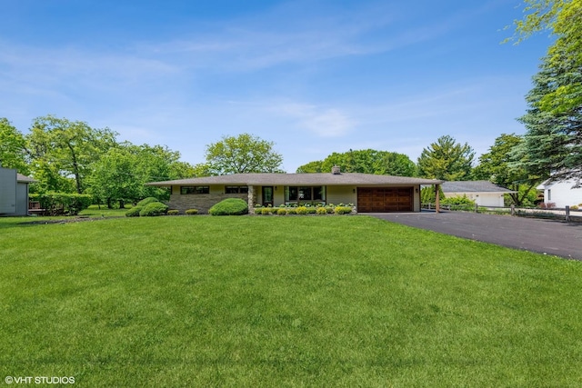 37782 N Cedar Lake Rd, Lake Villa, IL 60046 - ranch-style home with an attached garage, asphalt driveway, and a front lawn