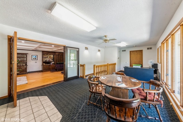 37782 N Cedar Lake Rd, Lake Villa, IL 60046 - carpeted dining area featuring a textured ceiling, a ceiling fan, and tile patterned floors