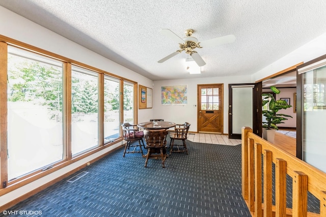 37782 N Cedar Lake Rd, Lake Villa, IL 60046 - dining space featuring a textured ceiling, a ceiling fan, and carpet flooring