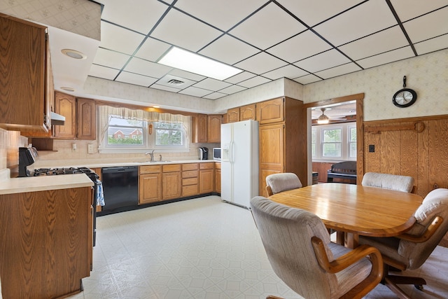 30W311 W Bartlett Rd, Bartlett, IL 60103 - kitchen featuring white fridge with ice dispenser, black dishwasher, range with gas cooktop, light countertops, and light flooring
