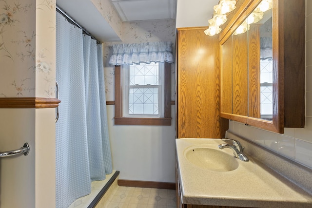 30W311 W Bartlett Rd, Bartlett, IL 60103 - full bath featuring wallpapered walls, vanity, a shower with shower curtain, and baseboards