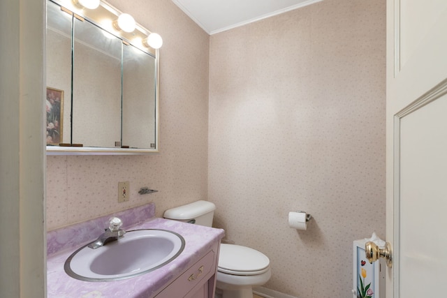 30W311 W Bartlett Rd, Bartlett, IL 60103 - bathroom featuring toilet, vanity, wallpapered walls, and ornamental molding