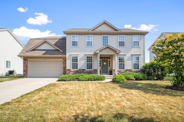 1014 Bayside Ln, Shorewood, IL 60404 - view of front of property with an attached garage, a front yard, driveway, stone siding, and roof with shingles