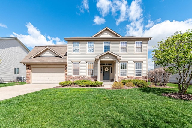 1014 Bayside Ln, Shorewood, IL 60404 - view of front of property with stone siding, driveway, a garage, and a front lawn