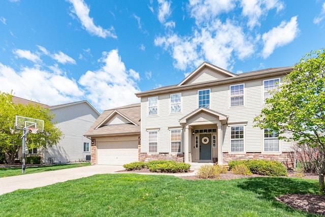 1014 Bayside Ln, Shorewood, IL 60404 - view of front of home with stone siding, concrete driveway, a front yard, and an attached garage