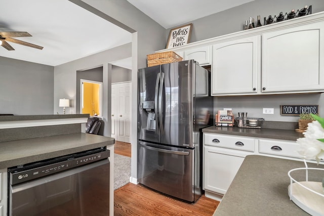 1014 Bayside Ln, Shorewood, IL 60404 - kitchen with appliances with stainless steel finishes, light wood finished floors, ceiling fan, white cabinetry, and dark countertops