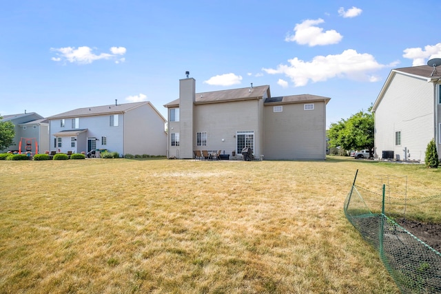 1014 Bayside Ln, Shorewood, IL 60404 - back of house with a chimney and a yard