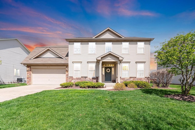 1014 Bayside Ln, Shorewood, IL 60404 - view of front of property with a garage, driveway, stone siding, and a front lawn