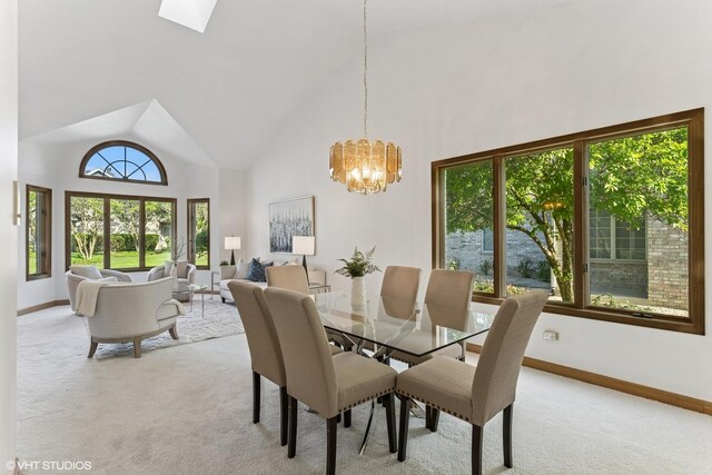 3 Lake Katherine Dr Unit 0, Palos Heights, IL 60463 - dining space with light colored carpet, a chandelier, high vaulted ceiling, baseboards, and a skylight