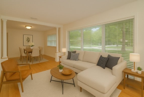 6N002 Laurel Dr, Medinah, IL 60157 - living area featuring ornate columns and light wood-type flooring