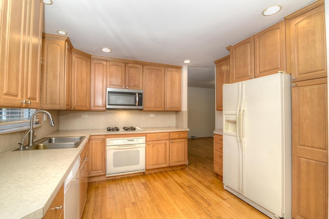 6N002 Laurel Dr, Medinah, IL 60157 - kitchen featuring white appliances, a sink, recessed lighting, light wood-type flooring, and tasteful backsplash