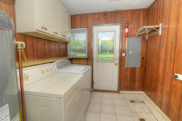 6N002 Laurel Dr, Medinah, IL 60157 - laundry room featuring electric panel, washing machine and dryer, cabinet space, wooden walls, and light tile patterned flooring