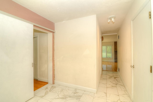 6N002 Laurel Dr, Medinah, IL 60157 - hall featuring light marble finish flooring and baseboards